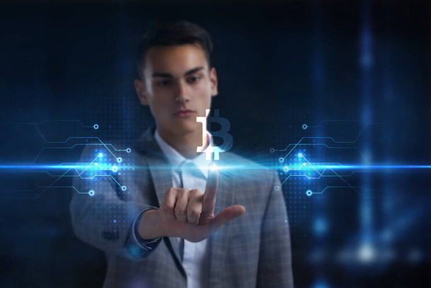 Business, Technology, Internet and network concept. Young businessman working on a virtual screen of the future and sees the inscription:  - Photo, Image