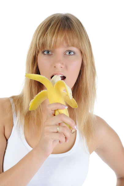 Blonde girl with a banana. - 写真・画像