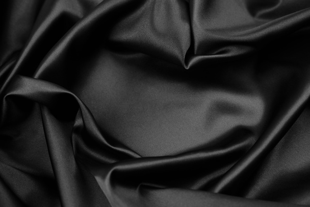 Primer plano de tela de seda negra ondulada - Foto, Imagen