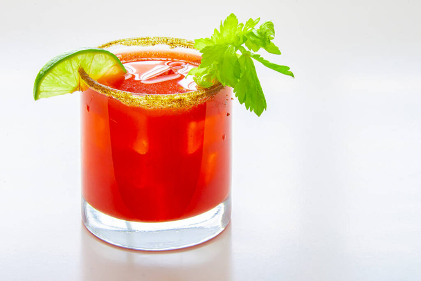 Close up of a cold caesar cocktail or bloody mary on a glass on a white background - Fotografie, Obrázek