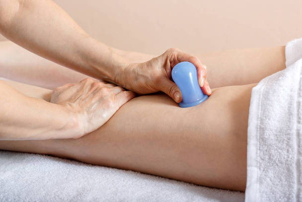 Healing massage. Close up of female legs. A woman came for a healing massage to a professional masseur. - Φωτογραφία, εικόνα