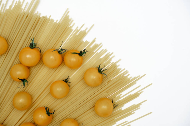 pasta and tomatoes on a white background. Food Delivery, Donation, Coronavirus Quarantine. Copy space. - Photo, Image