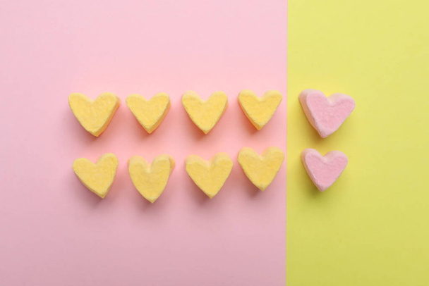 Flat lay composition with marshmallow hearts on color background. Pareto principle concept - Фото, зображення