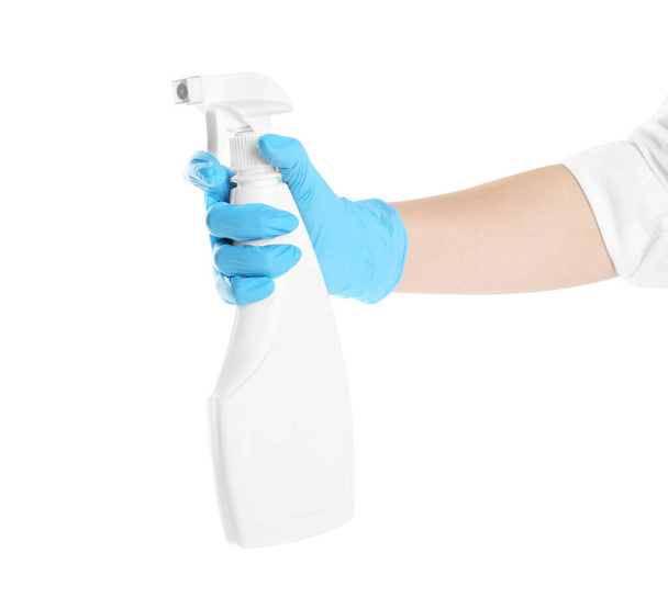 Woman in blue latex gloves with spray detergent on white background, closeup of hand - Foto, imagen