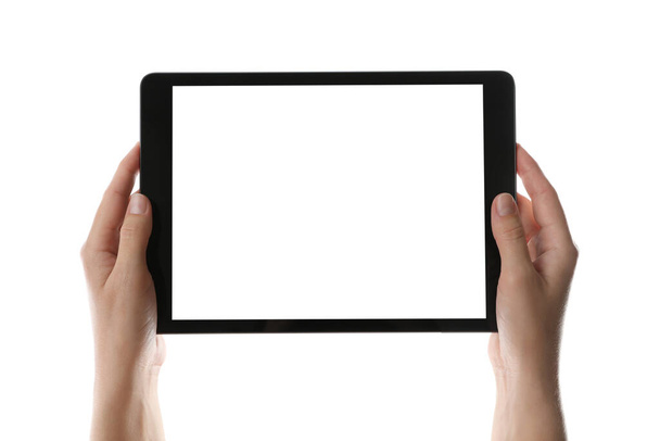 Mujer sosteniendo tableta con pantalla en blanco sobre fondo blanco, primer plano. Gadget moderno
 - Foto, Imagen