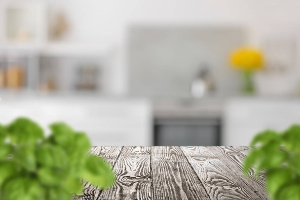 Wooden table with plants in modern kitchen interior - Foto, Imagem