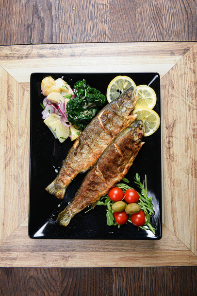 Grilled fish with fresh potato salad - Photo, Image