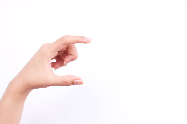 doigt main symboles isolé concept femme main tenant une carte de visite futuriste ou appareil photo ou téléphone mobile sur fond blanc
 - Photo, image