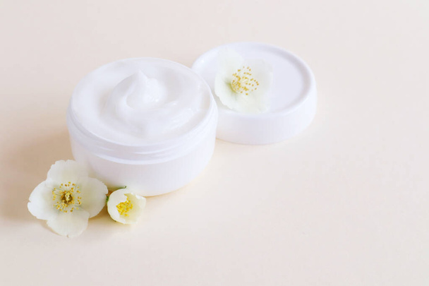 Cream moisturizer in the white jar. The concept of health and beauty. - Photo, image