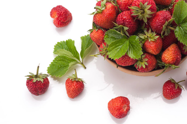 Red fresh strawberry in a bowl isolated on white background - 写真・画像