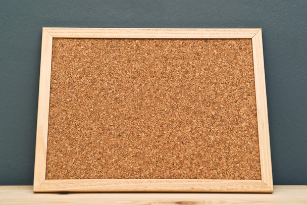 Cork memory board on wooden cabinet - Photo, image