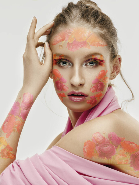 Portrait of beautiful young woman with modern floral design, inspiration artwork. Fashion, beauty concept. - Photo, image