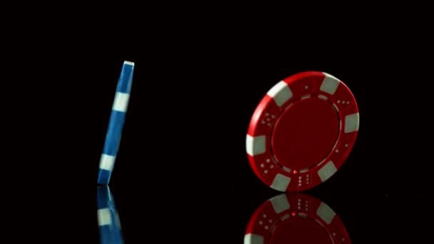 Super slow motion of rotating poker chips on black table. Filmed on high speed cinema camera, 1000fps. - Felvétel, videó