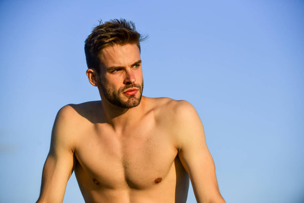 His body is perfect. sportsman and fitness model. naked strong man. muscular strong man has bristle on face. athletic body shape. shirtless guy relax at sunrise. young athletic guy with muscular body - Foto, afbeelding