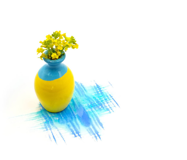 Small cute tiny vase with mini flowers bouquet and hand painted watercolor blot spot isolated on white background. Photo with free blank copy space for text. For cards, posters, website decoration. - Photo, Image