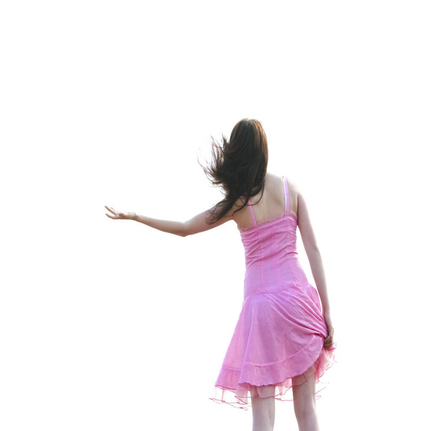 dancing brunette girl in short transparent pink dress  on her sexy legs isolated on white background - Φωτογραφία, εικόνα
