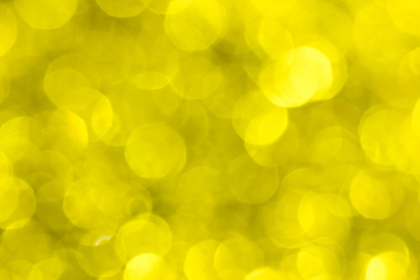 Golden glitter festive background with bokeh lights. Celebration concept for New Year, Christmas Holidays and happy valentine's day. - Photo, Image