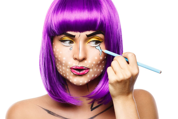Model in creative image with pop art makeup isolated on white background - 写真・画像