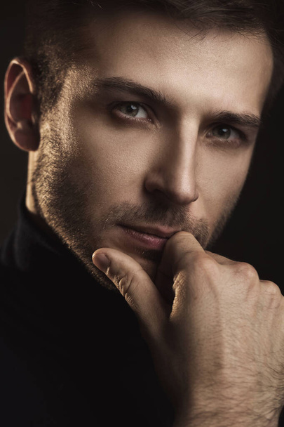 Portrait of young handsome man wearing a polo neck - Фото, зображення
