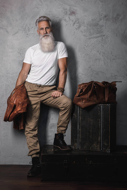 Stylish and handsome bearded senior man posing in studio - Zdjęcie, obraz