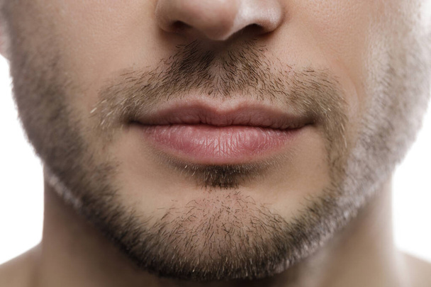 Close-up of male chin, bristle and lips. - 写真・画像