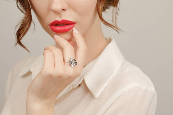 Close-up girl with a precious ring and pendant - Photo, Image