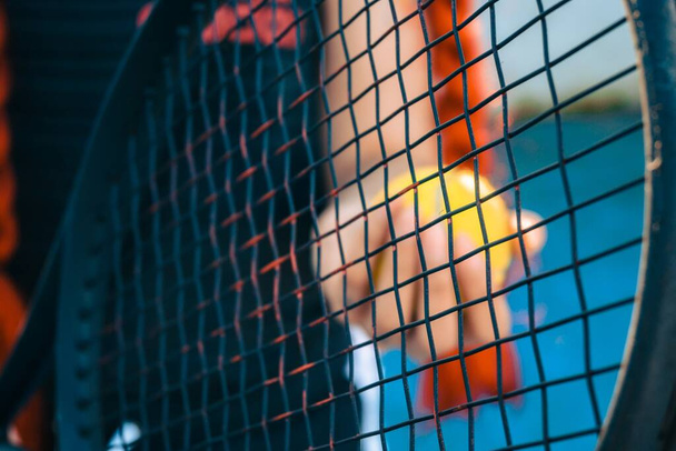 An amazing shot of a red-haired female playing tennis - Photo, Image