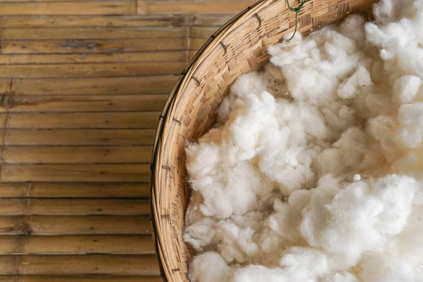 White cotton from dry kapok fruit in  bucket. - Photo, Image