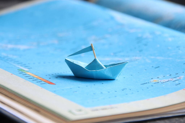 Travel concept, Paper boat on a map.  - Fotoğraf, Görsel