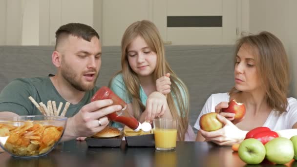 Dad loves fast food and treats teenage daughter. Mom eats vegetarian food and wants to introduce a daughter to this. Unfortunately for mothers, daughter chooses fast food. - Footage, Video