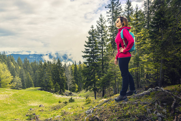 Back to nature. Living healthy lifestyle. Young woman hiking in the wilderness. - Foto, Imagem