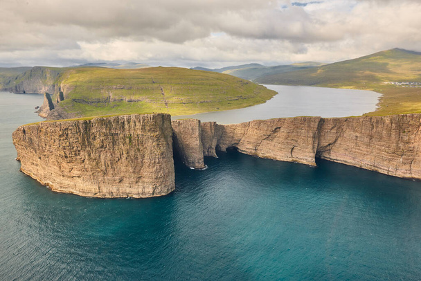 Faroe islands dramatic coastline in Vagar from helicopter. Leitisvatn lake - Photo, Image