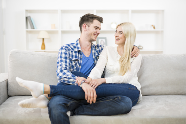 The smile couple relax on the sofa - 写真・画像