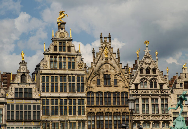 Antwerp, Flanders, Belgium. August 2019. On a beautiful sunny day detail of the facades of the guild houses in the town hall square. Elegant gilding embellishes the Renaissance architecture. - Photo, Image