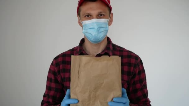 The Courier Delivers Food Home. Delivery Of Food In Quarantine. - Materiał filmowy, wideo