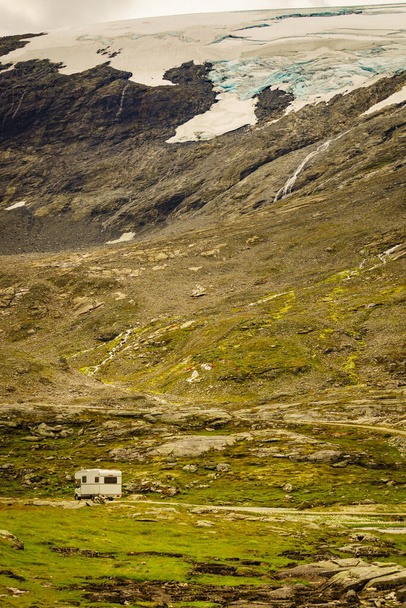 Camper in norwegian mountains. Camping on nature. Traveling, holidays and adventure concept. - 写真・画像