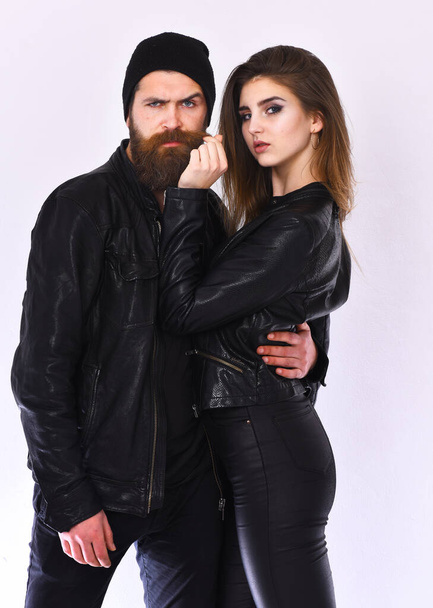 Girl and bearded man in black leather jacket and hat - Fotografie, Obrázek