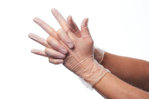 Female hands using vinyl gloves - Photo, Image