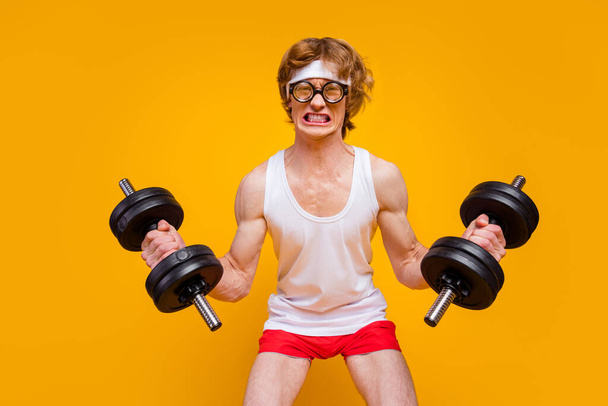 Portrait of his he nice attractive funky motivated guy sportsman lifting heavy barbell endurance hard regime plan isolated over bright vivid shine vibrant yellow color background - Foto, immagini