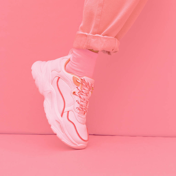 Fashion Sneakers shoes. Minimal monochrome design. Pastel pink aesthetic - Foto, afbeelding
