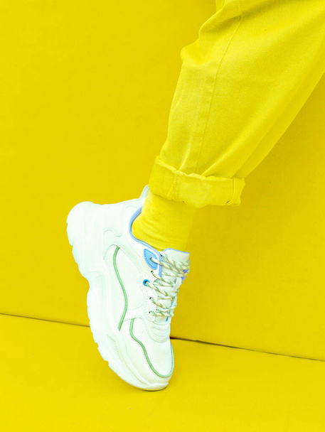 Fashion Sneakers. Minimal monochrome design.  Yellow aesthetic - Foto, Imagen