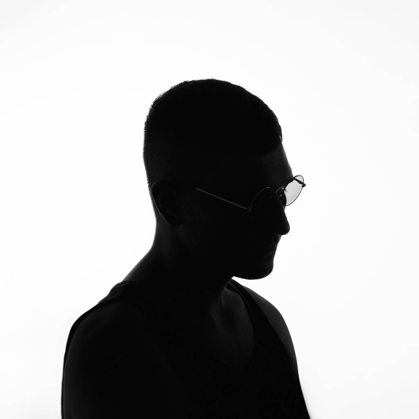 Silhouette of a man with glasses - Photo, image