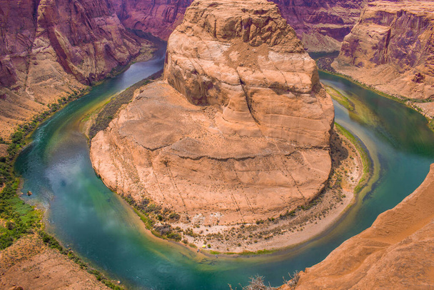 The Horseshoe Bend near Page in the US state of Arizona on a summer day with lots of colors - Photo, Image