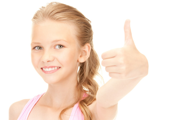 Lovely girl showing thumbs up sign - Фото, зображення