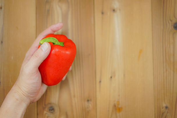 The hands of men with paprika - 写真・画像