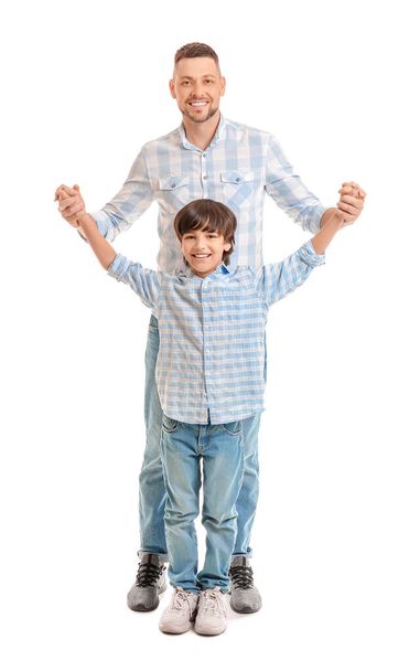 Father and little son on white background - Photo, Image