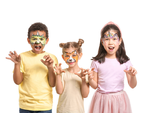 Funny children with face painting on white background - Foto, imagen