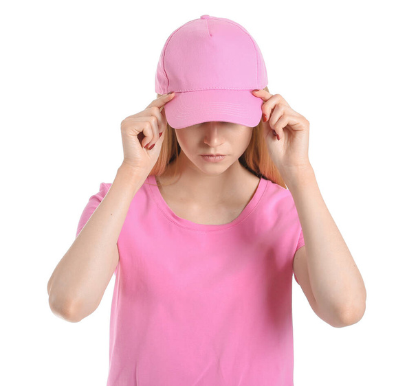 Beautiful young woman in stylish cap on white background - Photo, Image