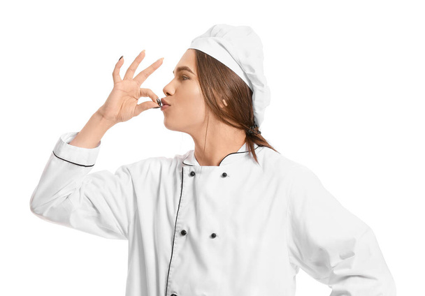 Transsukupuolinen kokki valkoisella taustalla
 - Valokuva, kuva
