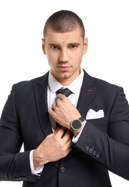 Handsome young man in elegant suit on white background - Fotografie, Obrázek